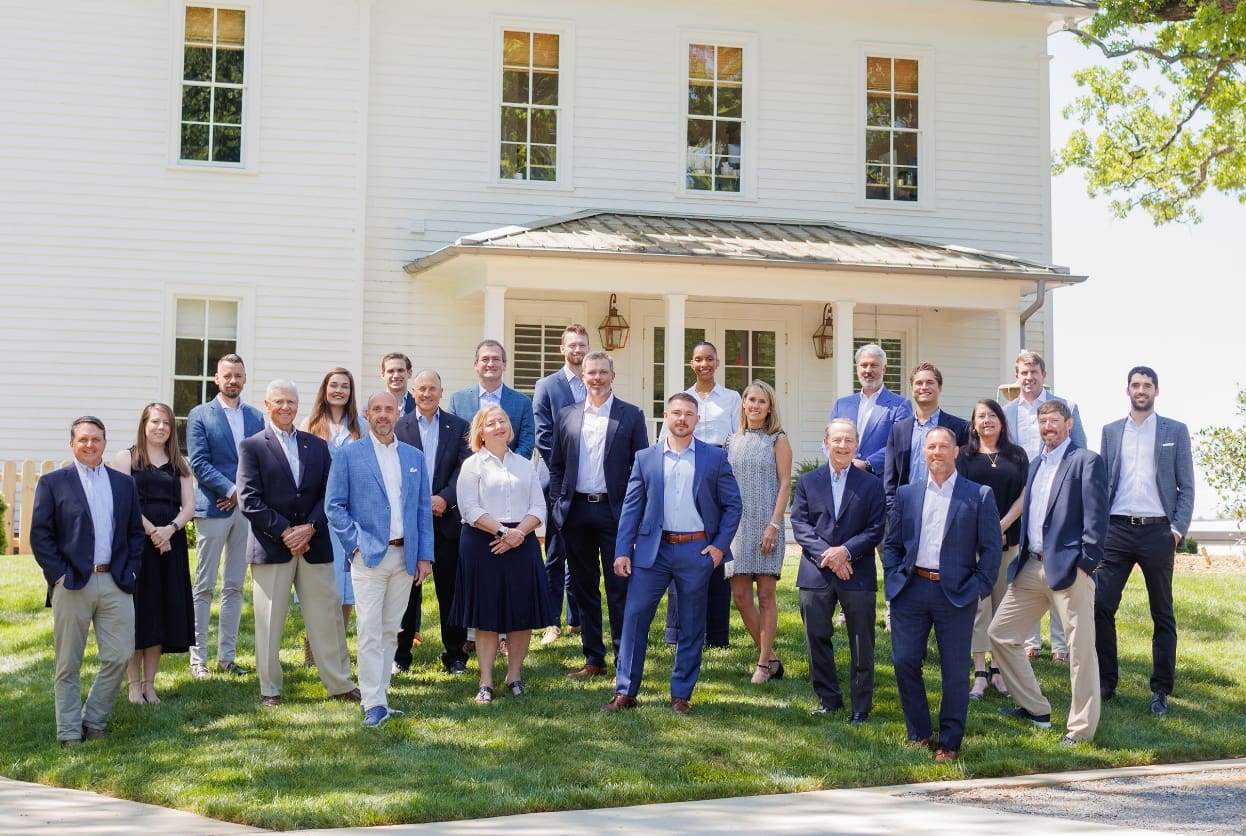 MECA Commercial Real Estate Team Members standing in front of office