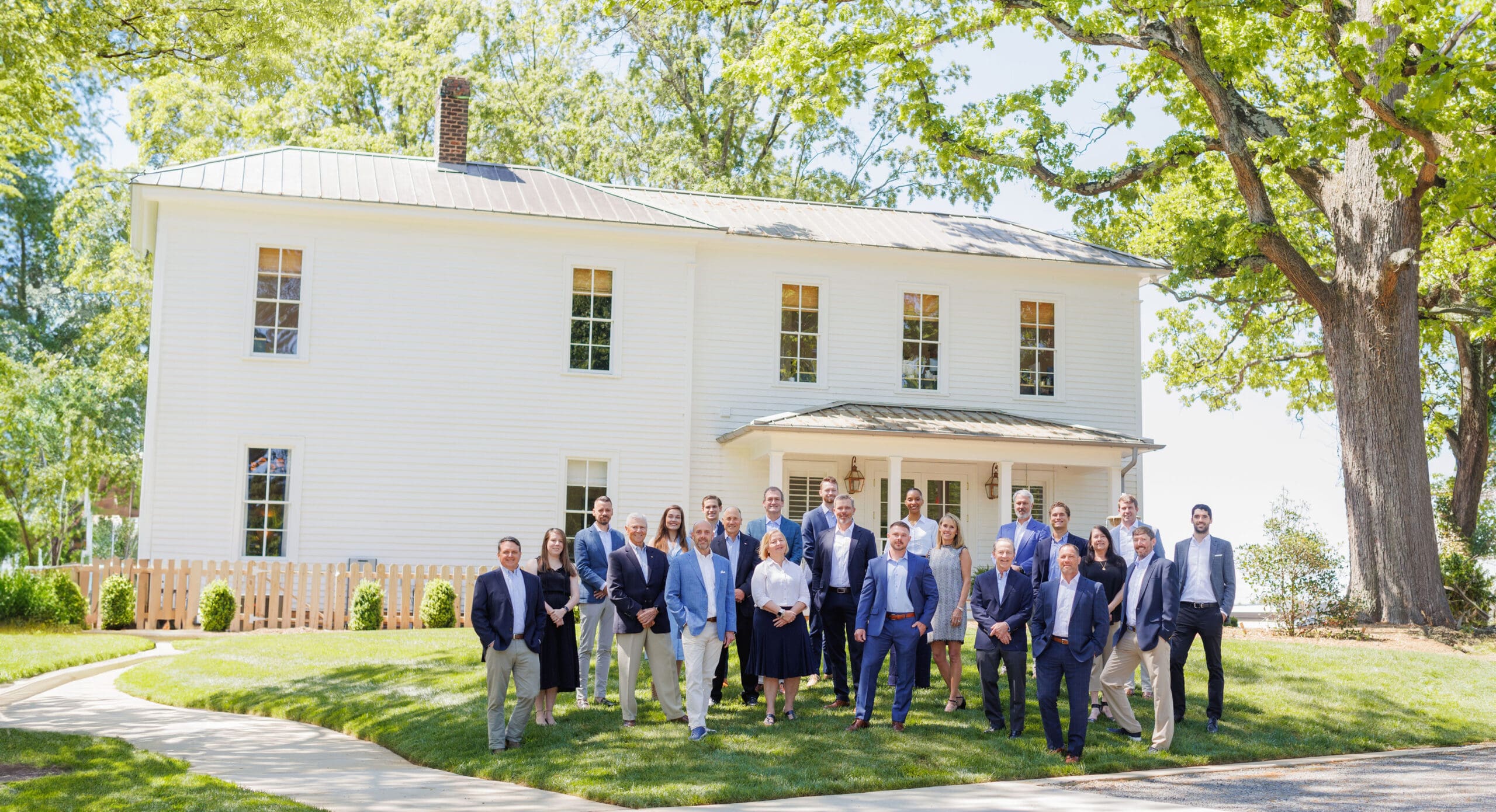 MECA Commercial Real Estate team members standing in front of historic office building