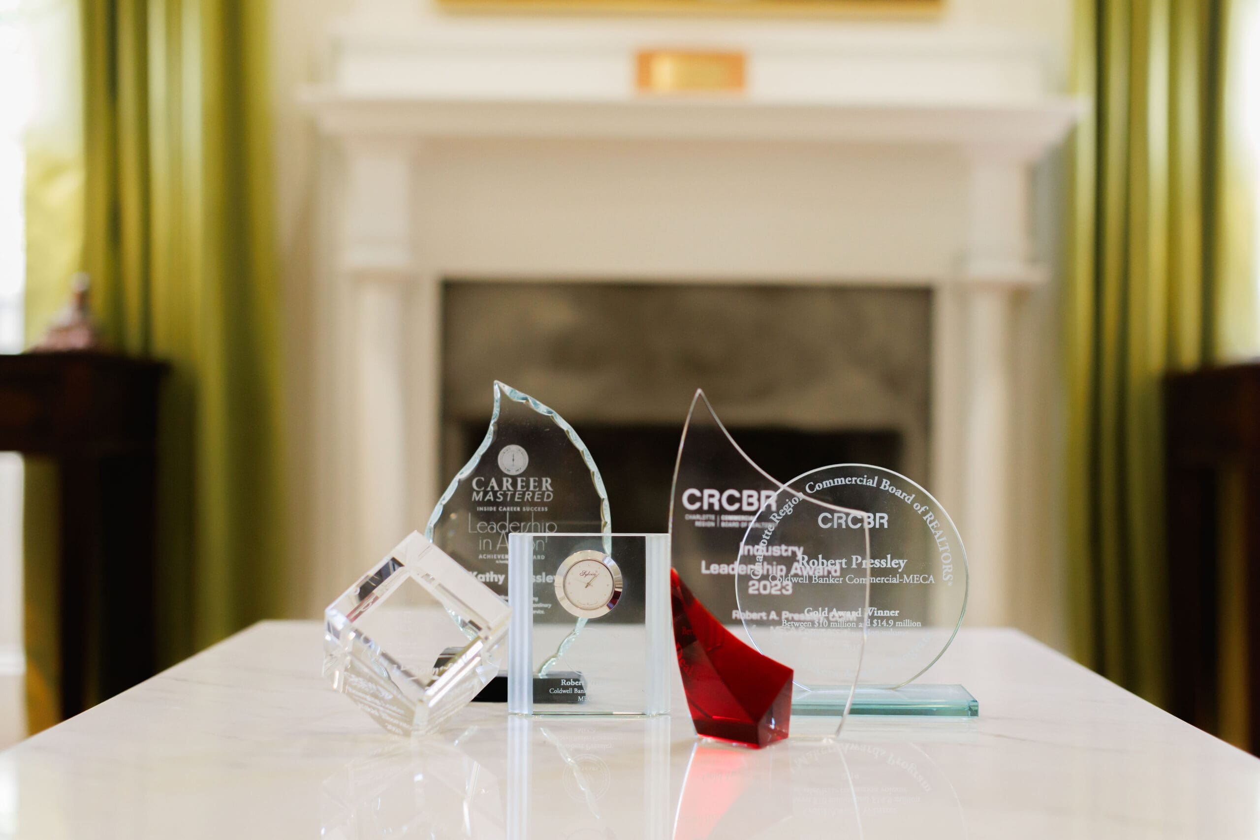 MECA Commercial Real Estate awards displayed on a table